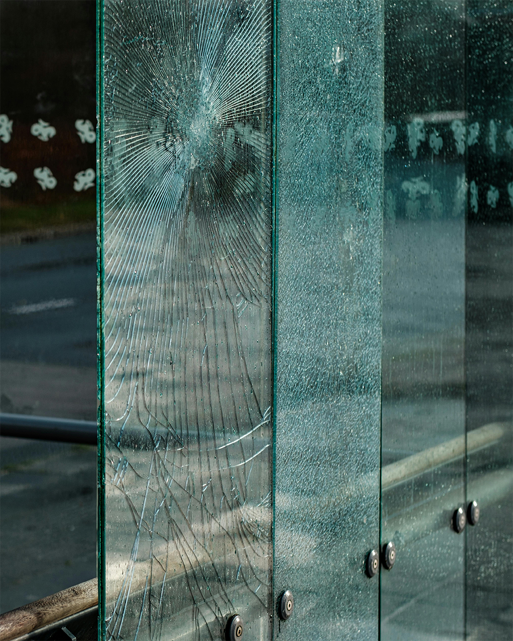 Broken glass showing forced entry attempt that security window film helps slow and deter